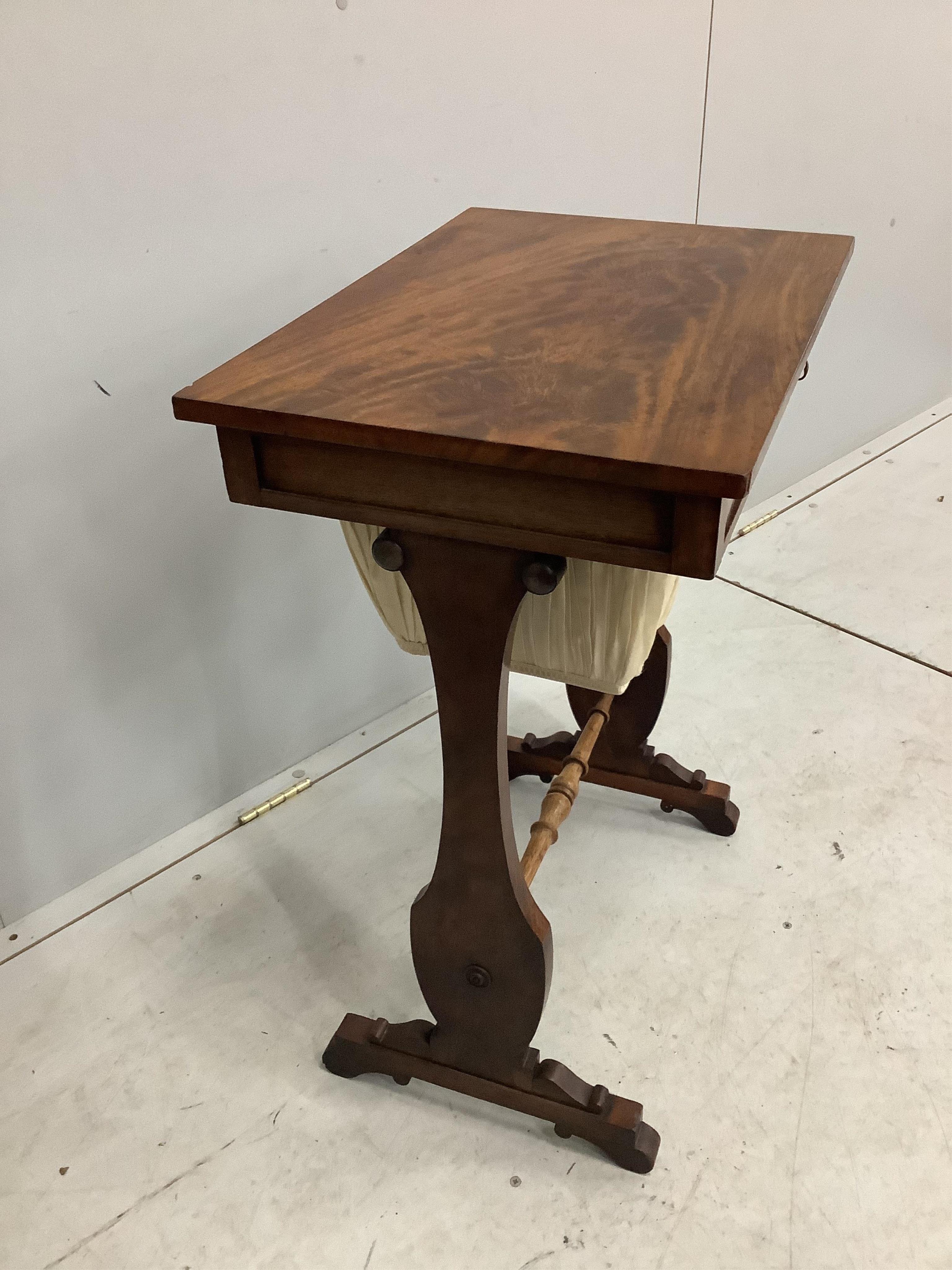 An early Victorian mahogany work table, width 54cm, height 72cm. Condition - good but for rubbing to the stretcher